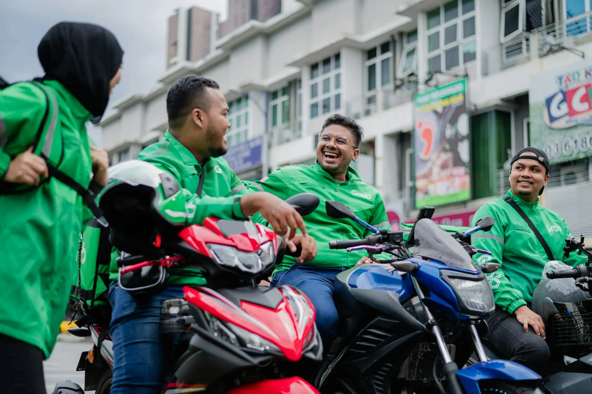 a group of men riding on the back of motorcycles